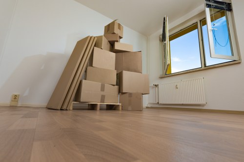 Professional movers loading furniture for small removals in West Kensington