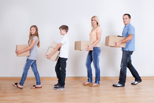 Professional movers packing household items for a Westkensington relocation